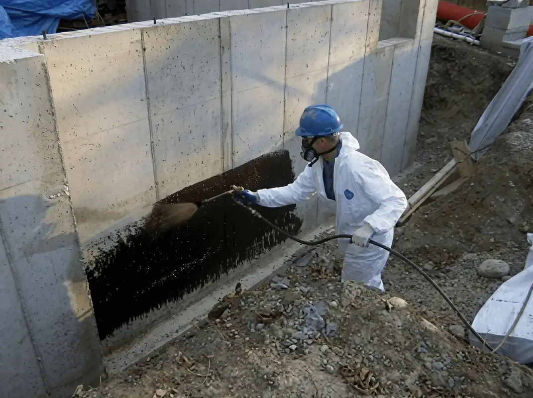 Professional waterproofing the exterior walls of the basement in Boston, MA