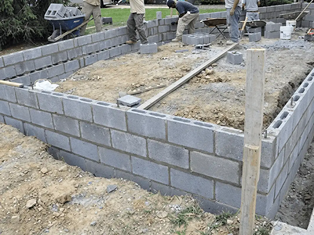 Professionals building a foundation with blocks in Boston, MA
