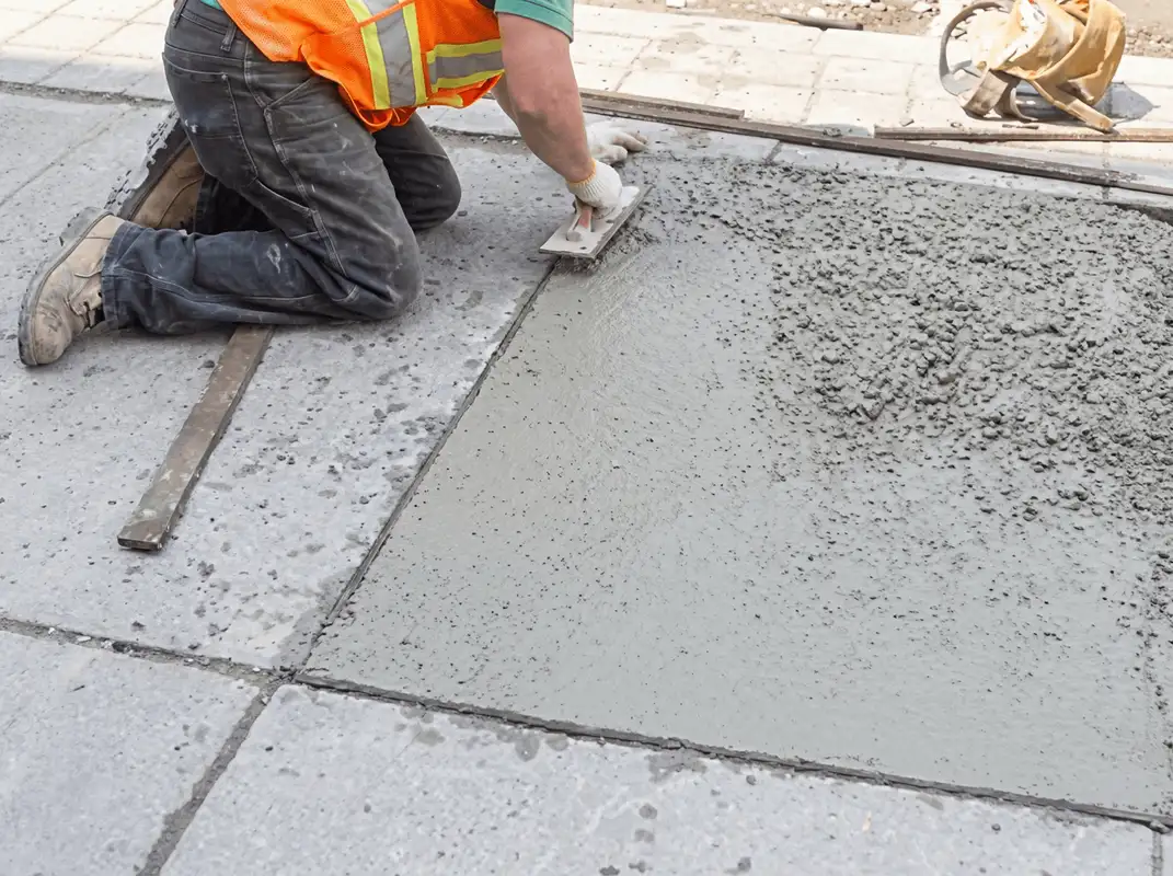 Professional repairing a concrete floor in Boston, MA