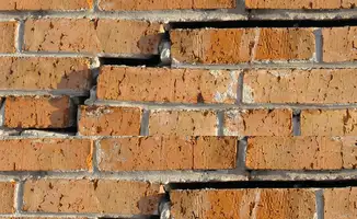 Brick wall with serious structural damage in Boston, MA